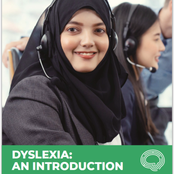A person wearing a headset and smiling above a green banner which reads Dyslexia: An Introduction